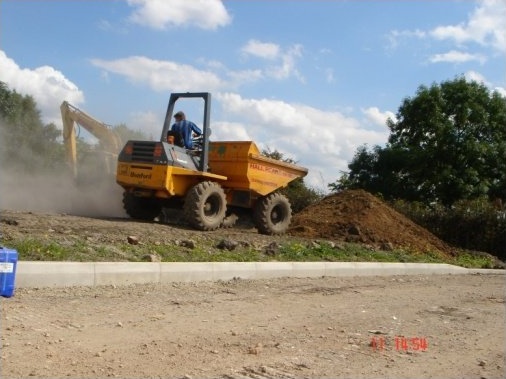 Soil dug from trench being dumped