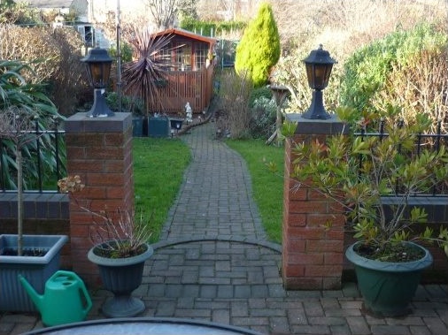 Block paved patio area and meandering garden path