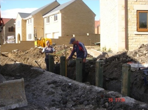 Ensuring wooden posts marking the boundary are level