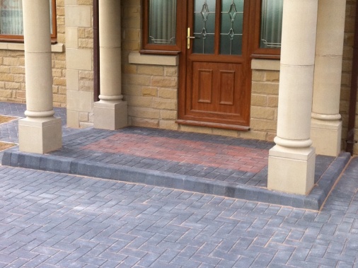 Feature matwell formed in brindle paving to form entrance as a contrast