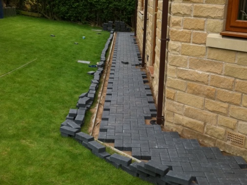 Near completed path to rear of property. Remaining blocks marked then cut using either a block cutter or stihl saw