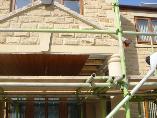 Golden oak cladding used to underside of portico in order to disguise underside of trusses